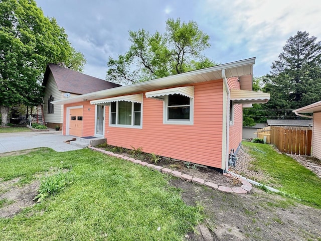 115 1st St SE, Pelican Rapids, MN 56572 - view of front facade featuring an attached garage and driveway