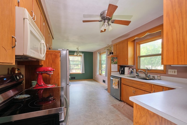 2003 20th Ave NW, Rochester, MN 55901 - kitchen with appliances with stainless steel finishes, a sink, healthy amount of natural light, and light countertops
