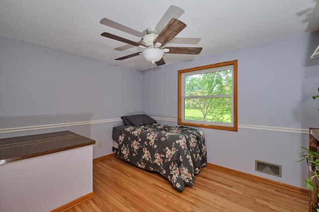 2003 20th Ave NW, Rochester, MN 55901 - bedroom featuring wood finished floors, baseboards, and ceiling fan