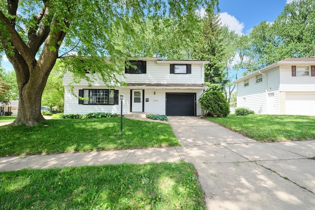2003 20th Ave NW, Rochester, MN 55901 - view of front of home with a garage, a front lawn, and concrete driveway
