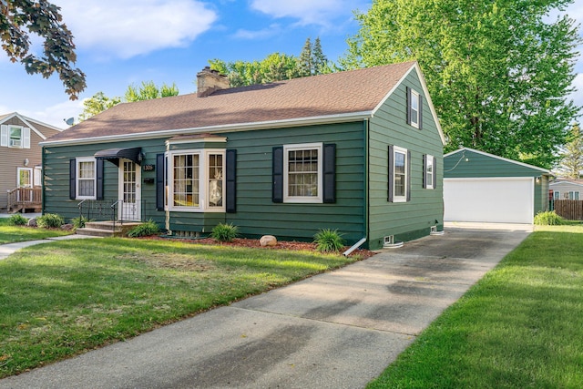 1306 3rd Ave SW, Austin, MN 55912 - view of front of house featuring an outdoor structure, a detached garage, a chimney, a front lawn, and a shingled roof