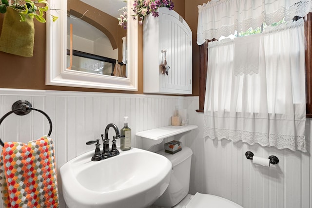 1306 3rd Ave SW, Austin, MN 55912 - bathroom with a sink, wainscoting, and toilet