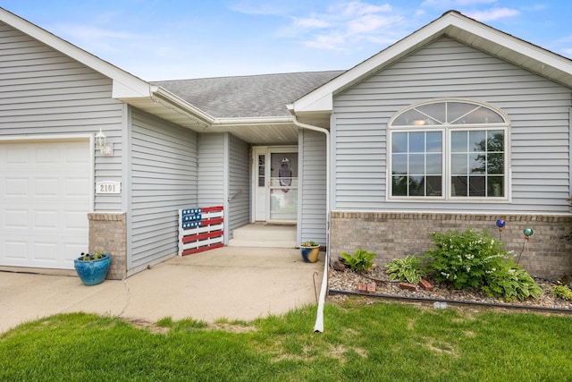2101 Blake Ave, Lester Prairie, MN 55354 - view of exterior entry with a garage, brick siding, and a shingled roof