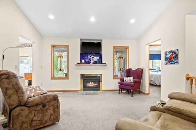 2101 Blake Ave, Lester Prairie, MN 55354 - living area featuring lofted ceiling, carpet, baseboards, a fireplace with flush hearth, and recessed lighting