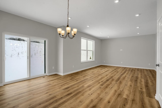 10664 29th St NE, Saint Michael, MN 55376 - unfurnished room with light wood-type flooring, a chandelier, recessed lighting, and baseboards
