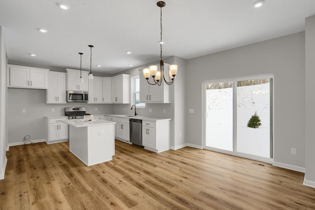 10664 29th St NE, Saint Michael, MN 55376 - kitchen featuring stainless steel appliances, baseboards, light wood-style floors, and recessed lighting