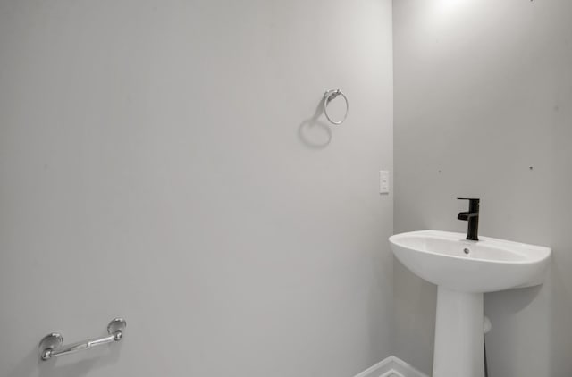 10664 29th St NE, Saint Michael, MN 55376 - bathroom featuring baseboards and a sink
