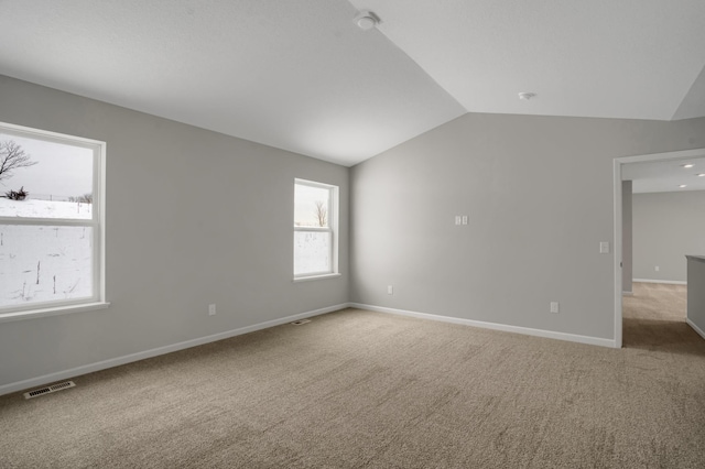 10664 29th St NE, Saint Michael, MN 55376 - spare room with lofted ceiling, carpet, and baseboards
