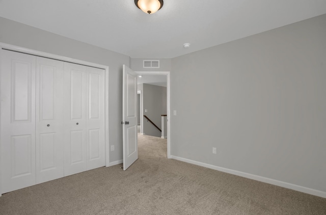 10664 29th St NE, Saint Michael, MN 55376 - unfurnished bedroom featuring light carpet, baseboards, and a closet