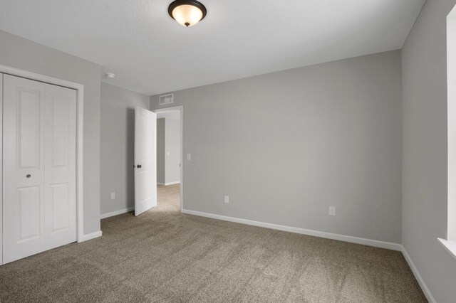 10664 29th St NE, Saint Michael, MN 55376 - unfurnished bedroom with carpet floors, a closet, and baseboards