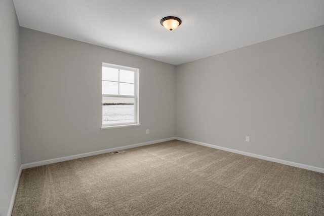 10664 29th St NE, Saint Michael, MN 55376 - carpeted spare room featuring baseboards