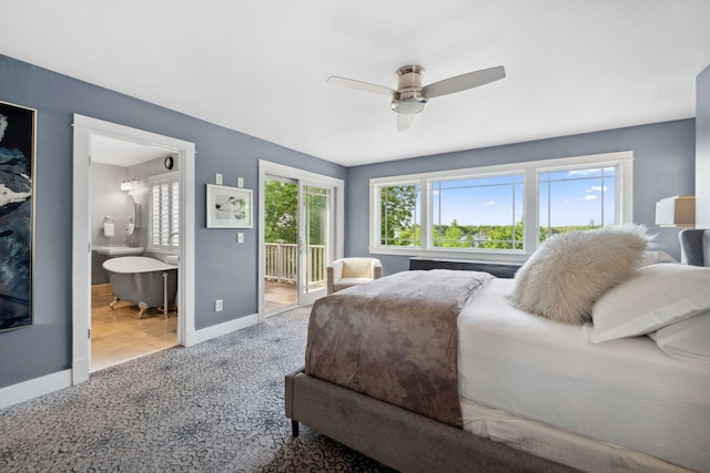 17209 Grays Bay Blvd, Minnetonka, MN 55391 - carpeted bedroom with multiple windows, access to exterior, baseboards, and ensuite bath