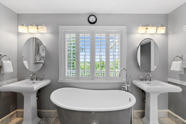 17209 Grays Bay Blvd, Minnetonka, MN 55391 - bathroom with baseboards and a freestanding bath