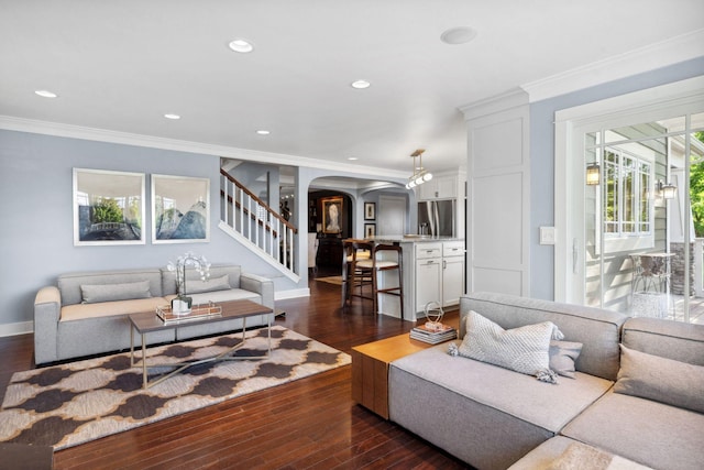17209 Grays Bay Blvd, Minnetonka, MN 55391 - living area featuring arched walkways, stairs, crown molding, dark wood-style floors, and baseboards