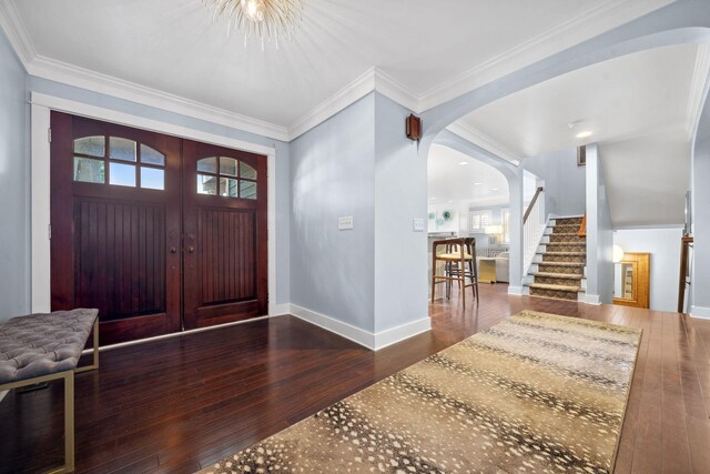 17209 Grays Bay Blvd, Minnetonka, MN 55391 - foyer entrance with arched walkways, hardwood / wood-style floors, stairway, healthy amount of natural light, and ornamental molding