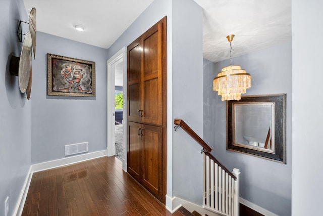 17209 Grays Bay Blvd, Minnetonka, MN 55391 - hall with baseboards, a chandelier, dark wood-style floors, and an upstairs landing