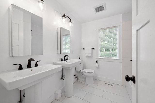 17209 Grays Bay Blvd, Minnetonka, MN 55391 - bathroom with toilet, tile patterned flooring, and baseboards