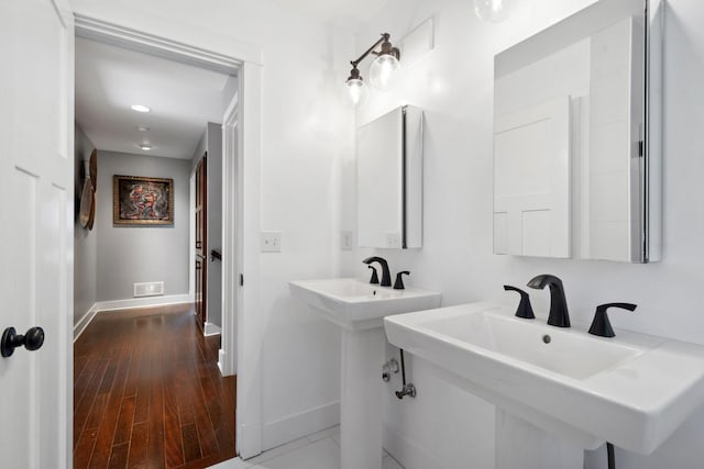 17209 Grays Bay Blvd, Minnetonka, MN 55391 - bathroom with baseboards, wood finished floors, and a sink