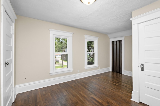 248 Ivy Ave W, Saint Paul, MN 55117 - spare room with dark wood finished floors, baseboards, and a textured ceiling