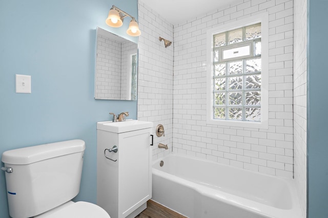 248 Ivy Ave W, Saint Paul, MN 55117 - full bathroom featuring toilet, vanity,  shower combination, and wood finished floors