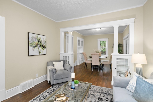 248 Ivy Ave W, Saint Paul, MN 55117 - living room with ornate columns, wood finished floors, crown molding, baseboards, and a textured ceiling