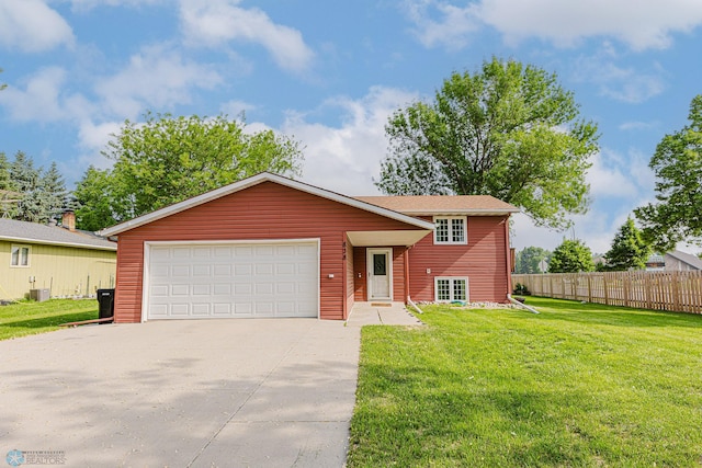 838 8th Ave E, West Fargo, ND 58078 - view of front of property with concrete driveway, a garage, and central AC