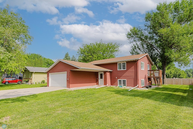 838 8th Ave E, West Fargo, ND 58078 - tri-level home featuring driveway, a garage, and a deck