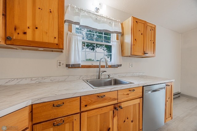 838 8th Ave E, West Fargo, ND 58078 - kitchen featuring stainless steel dishwasher, a sink, light countertops, and baseboards