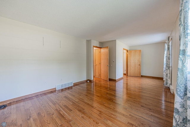 838 8th Ave E, West Fargo, ND 58078 - spare room featuring wood finished floors and baseboards