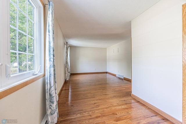 838 8th Ave E, West Fargo, ND 58078 - unfurnished room with wood finished floors and baseboards
