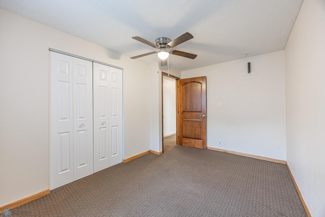 838 8th Ave E, West Fargo, ND 58078 - unfurnished bedroom featuring a closet, carpet floors, baseboards, ceiling fan, and a textured ceiling