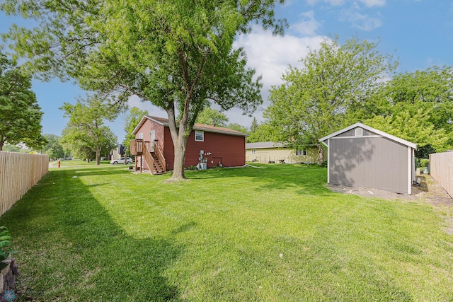 838 8th Ave E, West Fargo, ND 58078 - view of yard with stairway and a wooden deck