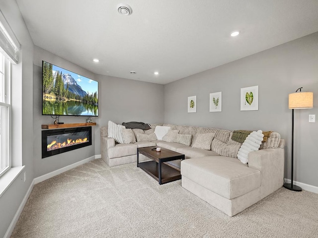 14540 112th Ave N, Dayton, MN 55369 - carpeted living area featuring baseboards, recessed lighting, and a glass covered fireplace