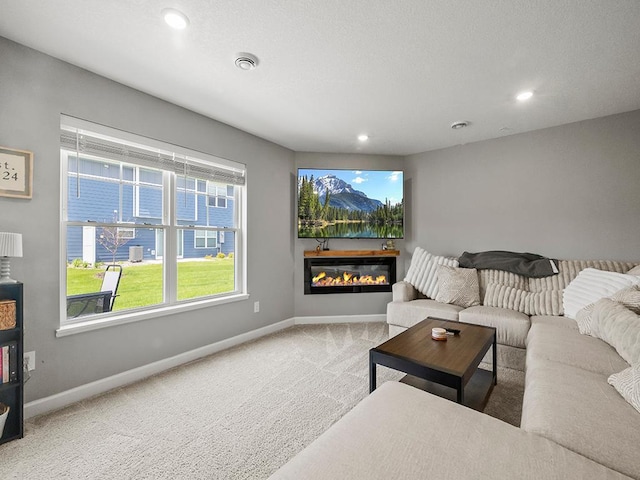 14540 112th Ave N, Dayton, MN 55369 - carpeted living area featuring baseboards, recessed lighting, and a glass covered fireplace