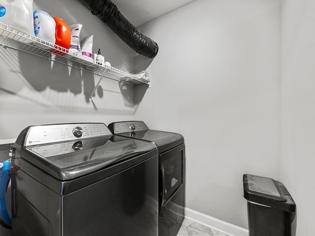 14540 112th Ave N, Dayton, MN 55369 - laundry room with baseboards and separate washer and dryer