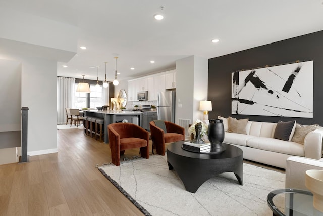 906 Woodlawn Ave Unit D, Saint Paul, MN 55116 - living area featuring light wood-style floors and recessed lighting