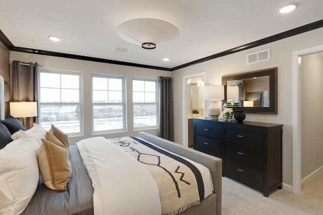 906 Woodlawn Ave Unit D, Saint Paul, MN 55116 - bedroom featuring crown molding, multiple windows, light colored carpet, baseboards, and ensuite bath