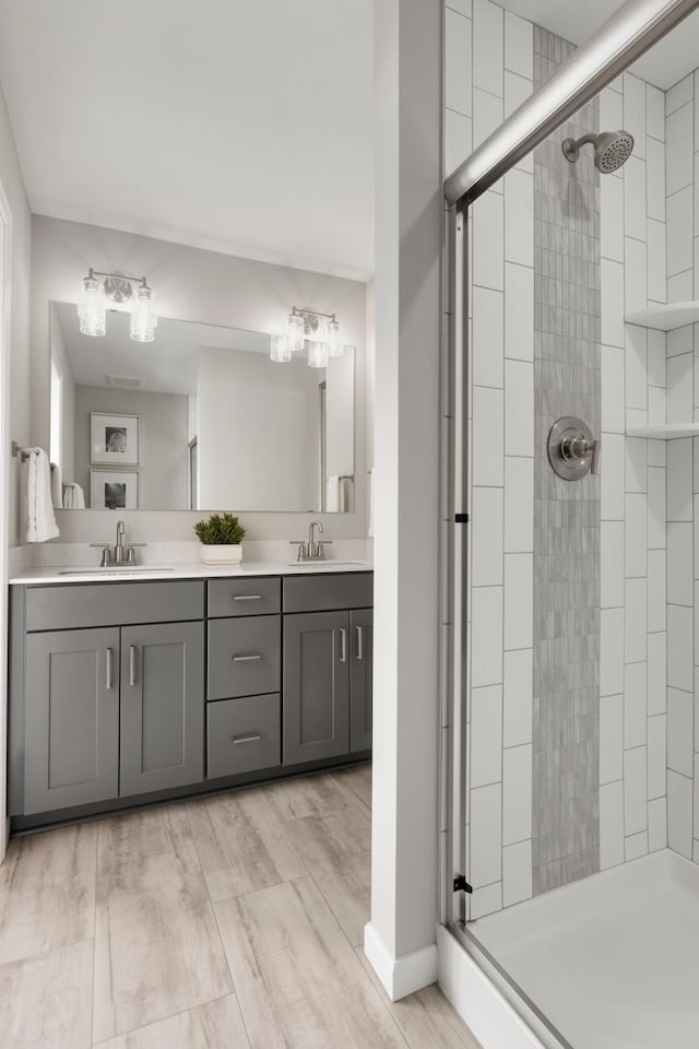 906 Woodlawn Ave Unit D, Saint Paul, MN 55116 - full bathroom with a shower stall and double vanity
