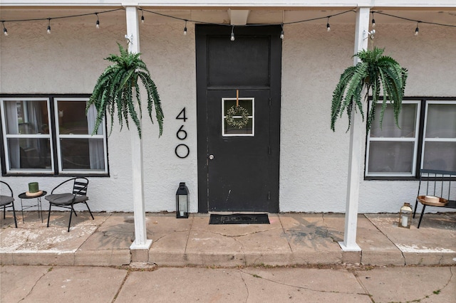 460 Broadway St E, New Germany, MN 55367 - property entrance with stucco siding and a patio