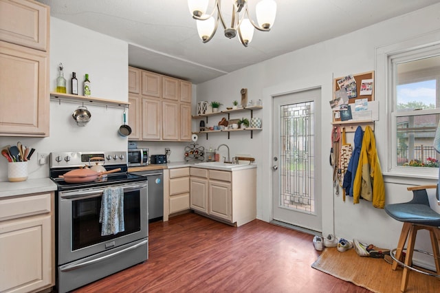 460 Broadway St E, New Germany, MN 55367 - kitchen with appliances with stainless steel finishes, open shelves, light countertops, a chandelier, and dark wood-style flooring