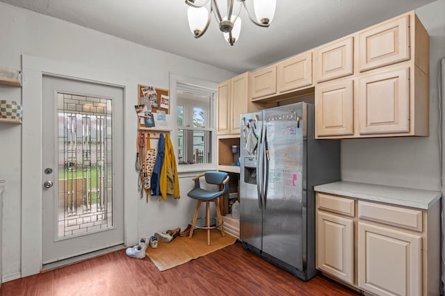 460 Broadway St E, New Germany, MN 55367 - kitchen with stainless steel fridge, a chandelier, light countertops, and dark wood-style floors