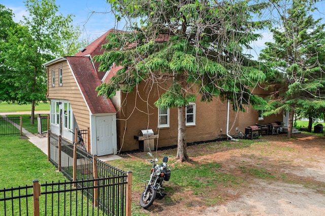 460 Broadway St E, New Germany, MN 55367 - view of side of home with stucco siding and a shingled roof