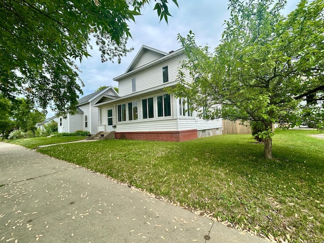214 2nd St SW, Wadena, MN 56482 - view of property exterior featuring a yard and entry steps