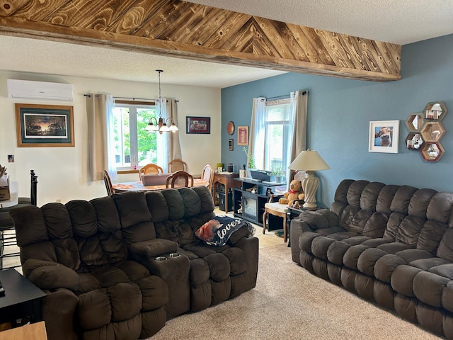 214 2nd St SW, Wadena, MN 56482 - carpeted living room featuring a wall unit AC and a chandelier