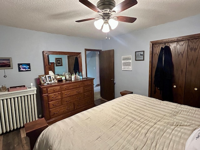 214 2nd St SW, Wadena, MN 56482 - bedroom with a textured ceiling, a closet, and a ceiling fan