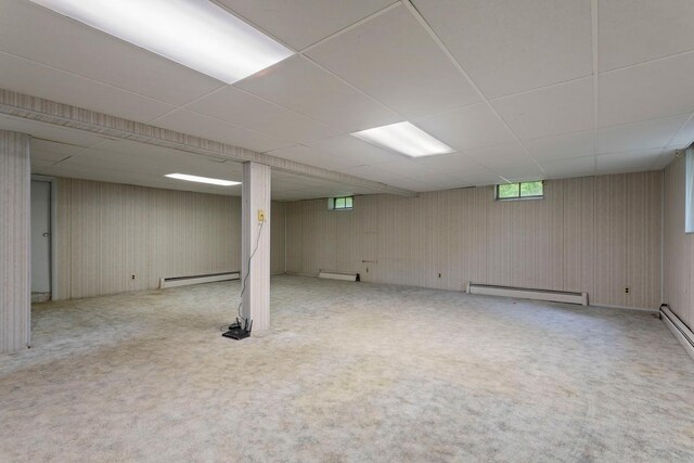 8309 39th St N, Lake Elmo, MN 55042 - basement with a baseboard radiator, a drop ceiling, and carpet
