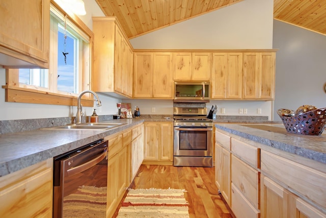 10080 550th St, Rock Creek, MN 55069 - kitchen with light brown cabinetry, appliances with stainless steel finishes, wood ceiling, a sink, and vaulted ceiling