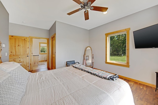 10080 550th St, Rock Creek, MN 55069 - bedroom featuring wood finished floors, baseboards, and a ceiling fan