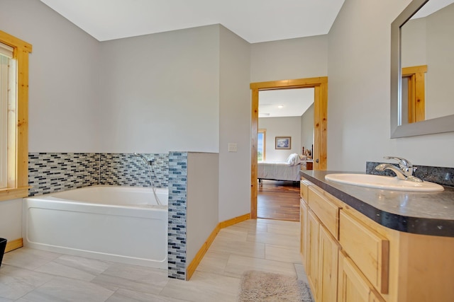 10080 550th St, Rock Creek, MN 55069 - full bath with connected bathroom, a bath, vanity, tile patterned floors, and baseboards