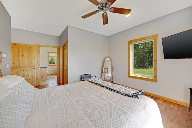 10080 550th St, Rock Creek, MN 55069 - bedroom featuring wood finished floors, baseboards, and a ceiling fan